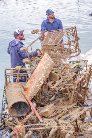 1st april 2019 divers removing dumped scrap and rubbish from alicante harbourのeditorial素材