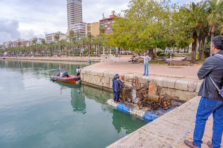 1st april 2019 divers removing dumped scrap and rubbish from alicante harbourのeditorial素材