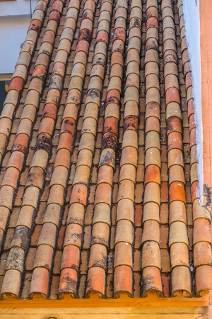 Red roof tiles on house in seville old townの写真素材