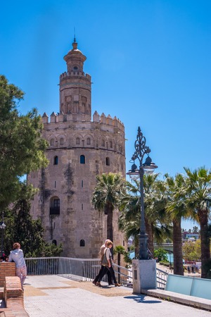 Seville Spain May 8th 2019 Golden tower (Torre del Oro) along the Guadalquivir river, Sevilleのeditorial素材
