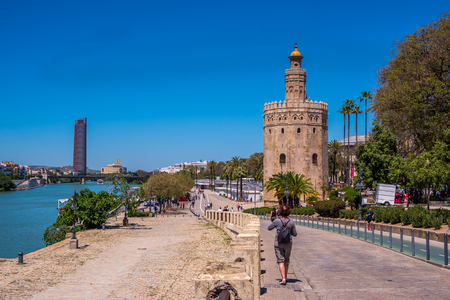 Seville Spain May 8th 2019 Golden tower (Torre del Oro) along the Guadalquivir river, Sevilleのeditorial素材
