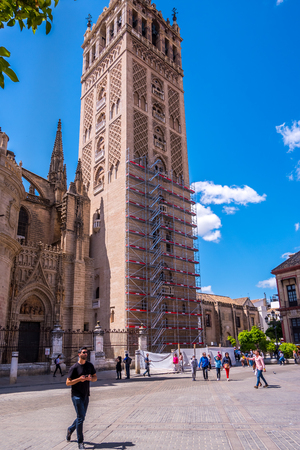 Seville, Spain - May 8th 2019 Seville Cathedral, seen from Calle Mateos Gago .のeditorial素材