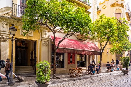 SEVILLE, SPAIN - May 8th 2019- Tourists relaxing at a pavement cafe in the city centre, Seville, Seville Province,のeditorial素材