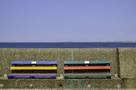 two colourful benches on the seafront at New Brighton UKの写真素材
