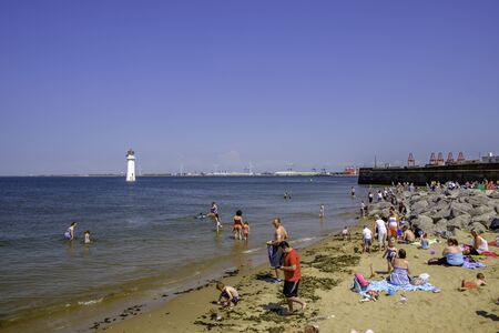 people swimming in the sea at New Brightonの写真素材