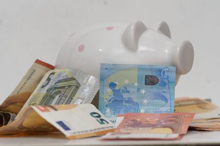 close up of euro money banknotes and piggy bankの写真素材