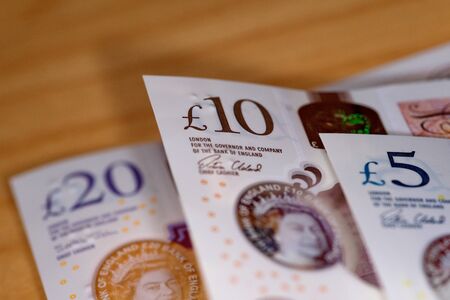 uk twenty pound notes trapped in mousetrapの写真素材