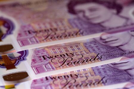 uk twenty pound notes trapped in mousetrapの写真素材