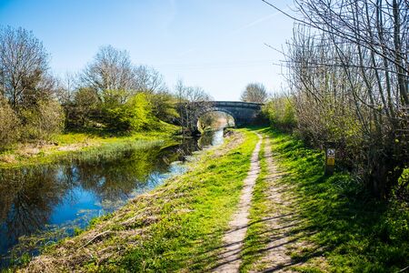 Scenic View of on the Lancster Canal Bathed in Warm Morning Sunlight Running through Cumbria Englandの写真素材
