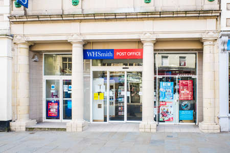 UNITED KINGDOM, LANCASTER - 9TH APRIL 2020 W H Smiths and Post Office one of the UK's leading retail groupsのeditorial素材