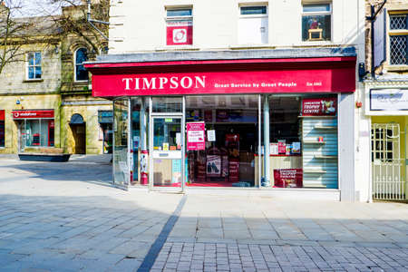 UNITED KINGDOM, LANCASTER - 9TH APRIL 2020 Timpson store on the corner of the market squareのeditorial素材