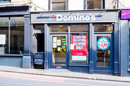 UNITED KINGDOM, LANCASTER - 9TH APRIL 2020 Domino's Pizza takeaway in city centre during lockdownのeditorial素材