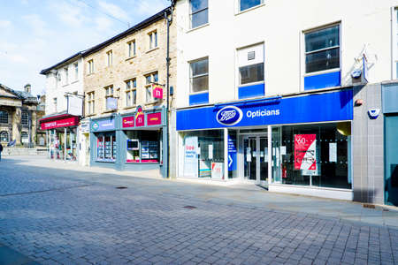 UNITED KINGDOM, LANCASTER - 9TH APRIL 2020 Exterior of Boots Optician shop shop during lockdown for Covid 19 virusのeditorial素材