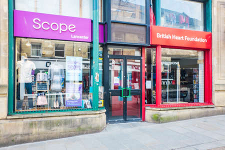 UNITED KINGDOM, LANCASTER - 9TH APRIL 2020 Exterior of Scope and BHF shop shop during lockdown for Covid 19 virusのeditorial素材
