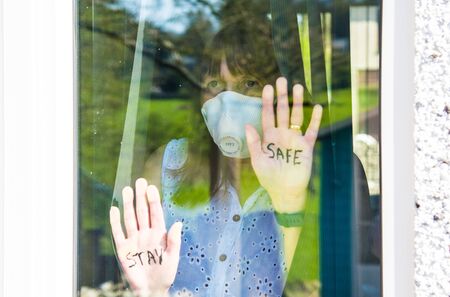 Woman with medical face mask Quarantine during Coronavirus pandemic. UKの写真素材