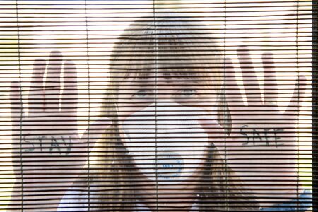 Woman with medical face mask Quarantine during Coronavirus pandemic. UKの写真素材