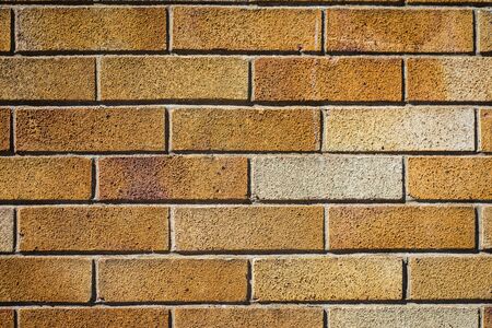 old red brick wall on a sunny spring dayの写真素材