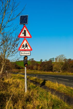 Solar powered traffic signs ,speed warning sign in a school zone,with Solar cells panel for Energy savings UKの写真素材