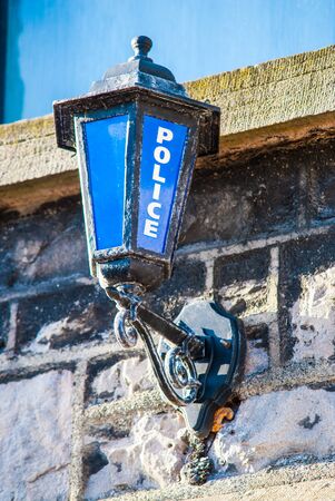 Old police station sign attached to wall in Milnthorpe Cumbria UKの写真素材