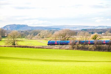 A TransPennine Express passenger train in the countrysideの写真素材