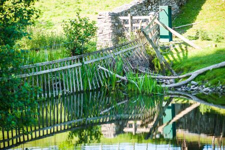Deer gates on the river Bela Dallam Park UKの写真素材