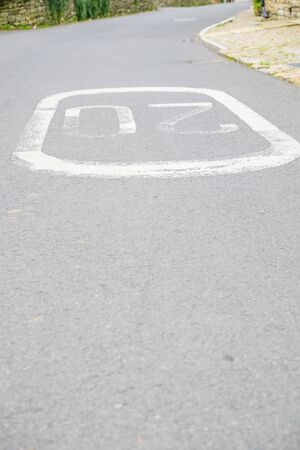 a speed limit sign painted on the road UKの写真素材