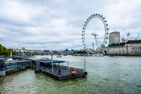 LONDON - AUGUST 18 : View of The London Eye on August 18, 2010 in London, England. A famous tourist attraction over river Thames in the capital city London.のeditorial素材