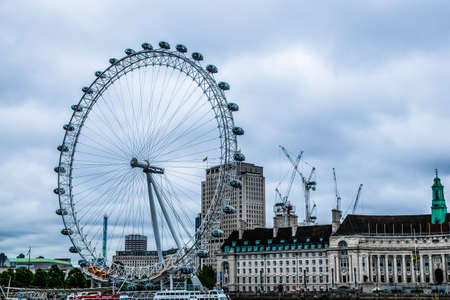 LONDON - AUGUST 18 : View of The London Eye on August 18, 2010 in London, England. A famous tourist attraction over river Thames in the capital city London.のeditorial素材