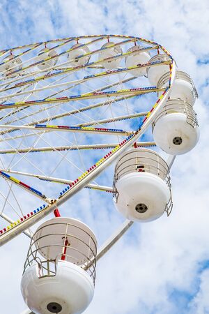 Ferris wheel on the pier at Blackpool against blue skyの写真素材