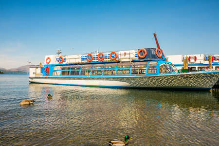Windermere, United Kingdom 25 May 2020 Cruise boats anchored by the Windermere Lake a summer dayのeditorial素材