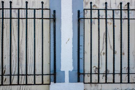 Close up of two Windows with black iron bars UKの写真素材