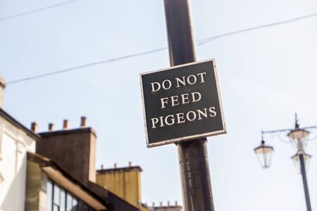 Do not feed the pigeons sign in market place Kendal UKの写真素材