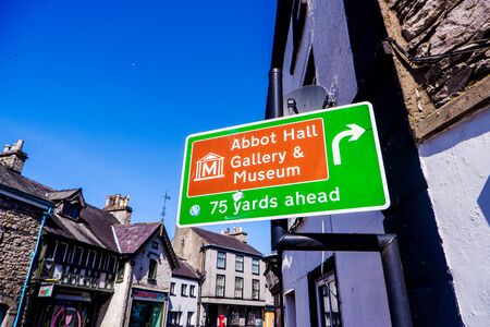 road sign showing directions to various placesの写真素材