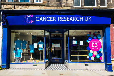 Lancaster UK 30 May 2020 Cancer research uk logo shop in Lancaster town centre.のeditorial素材