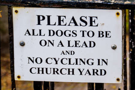 Keep all dogs on lead sign on churchyard UKの写真素材