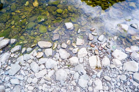 Horizontal background of pebbles and rivers edgeの写真素材