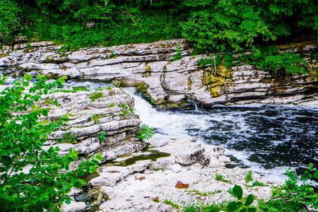 small waterfall in river Kent at force falls Sedwick UKの写真素材