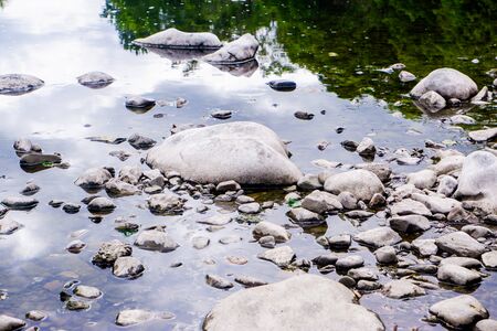 Horizontal background of pebbles and rivers edgeの写真素材