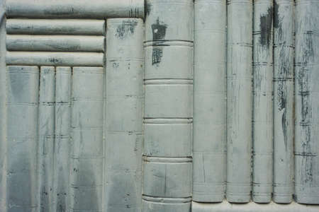 false books carved into a old wooden doorの写真素材