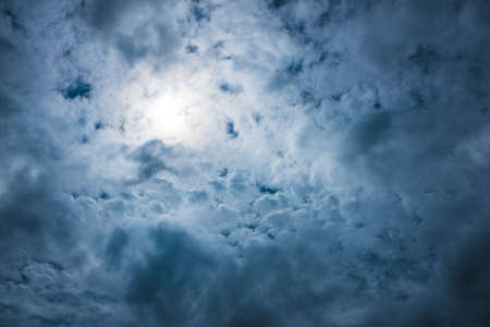 Stormy sky with beautiful middle light and cloudsの写真素材