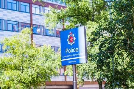 City of Gloucester Police Station sign and treesのeditorial素材