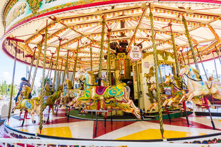 SOUTHPORT UNITED KINGDOM, 30 JUNE 2019 Horses on a golden gallopers ride at a traditional fairgroundのeditorial素材