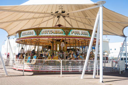 SOUTHPORT UNITED KINGDOM, 30 JUNE 2019 Horses on a golden gallopers ride at a traditional fairgroundのeditorial素材