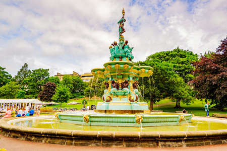 Edinburgh Scotland 7th august 2020 Ross Fountain with Edinburgh Castle in West Princes Street Gardensのeditorial素材