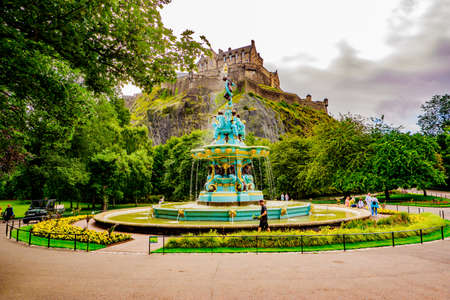 Edinburgh Scotland 7th august 2020 Ross Fountain with Edinburgh Castle in West Princes Street Gardensのeditorial素材