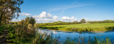 View of an English rural countryside scenery on British waterwayの写真素材