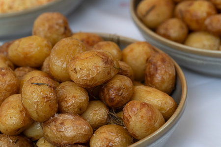 plate of baked potatoes on barbecueの写真素材