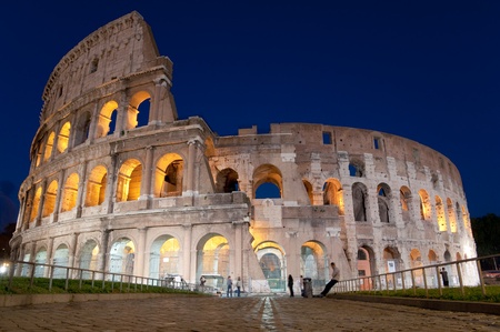 Colosseu and stone street at night in Rome - Italyの写真素材