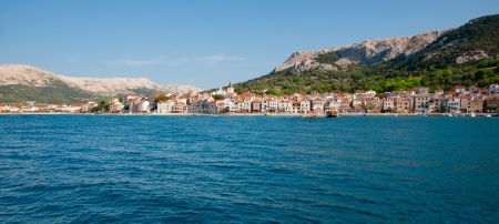 Panoramic view of Baska town and mountains from sea - Krk - Croatiaの写真素材