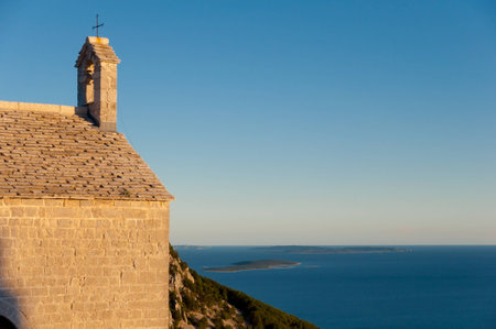 Church bells and rooftop at Lubenice in Cres - Croatiaの写真素材